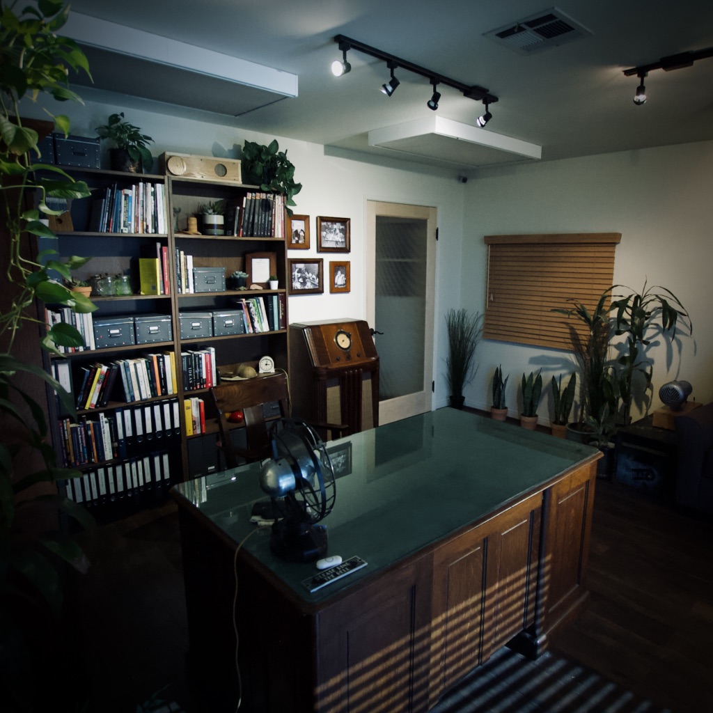Office space with bookshelves, files, and a worktable.”