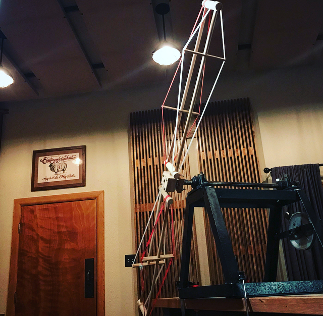 a large hand crank windwand device in a recording studio.