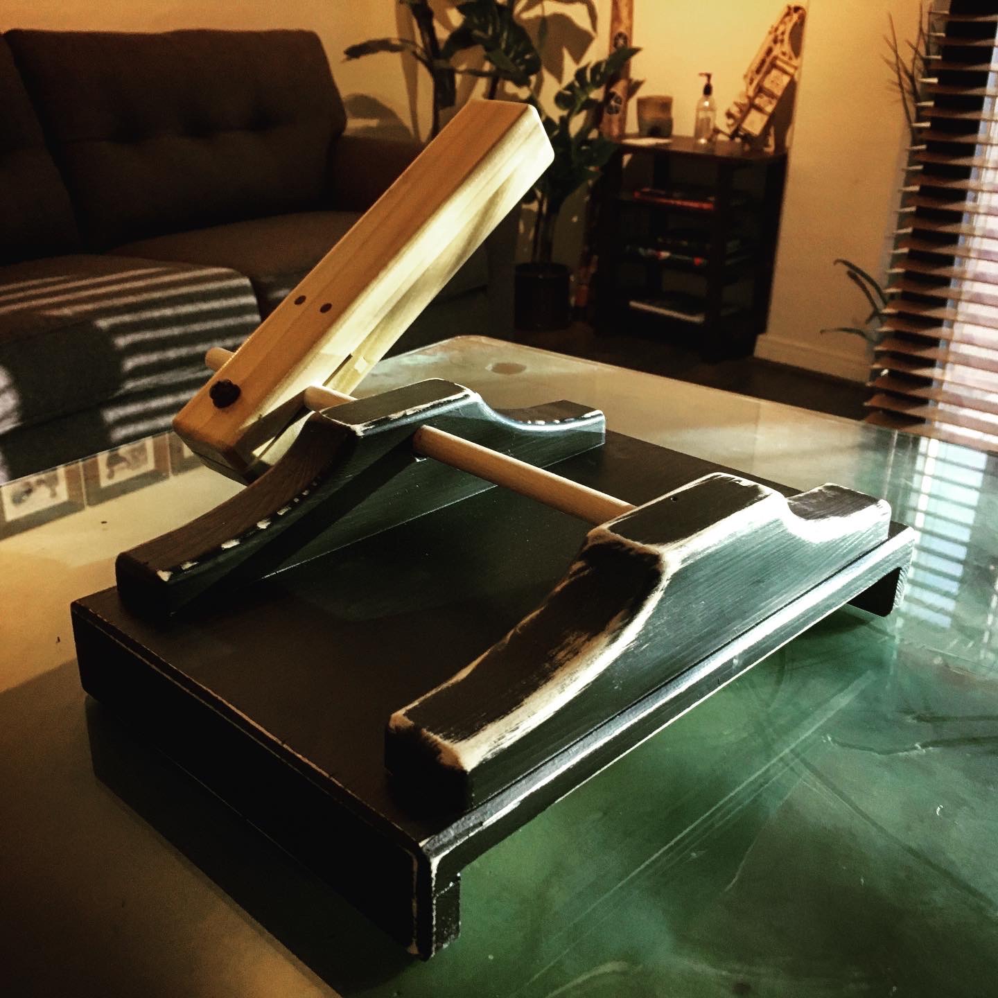 Custom-built mechanical soundmaking device resting on a desk.